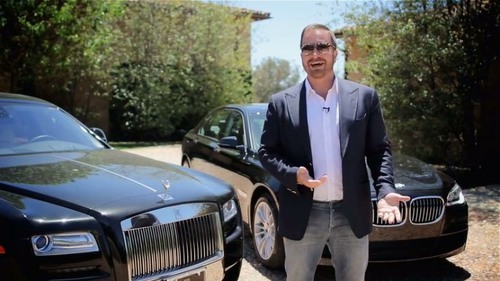 $28 net worth's Internet marketer Frank Kern in front of cars