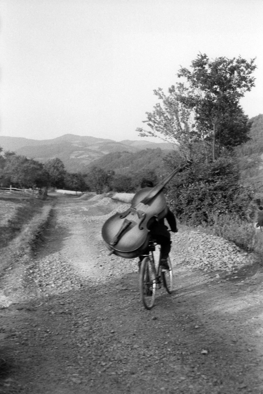 fewthistle:“ Serbia. Bass player on the way to play at a village festival. 1965Photographer: Henri Cartier-Bresson”