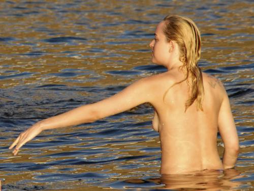 toplessbeachcelebs - Dakota Johnson (Actress) swimming topless...