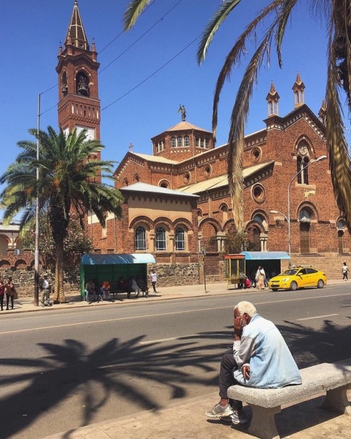 forafricans - A man sits on a bench by the road side. Asmara,...