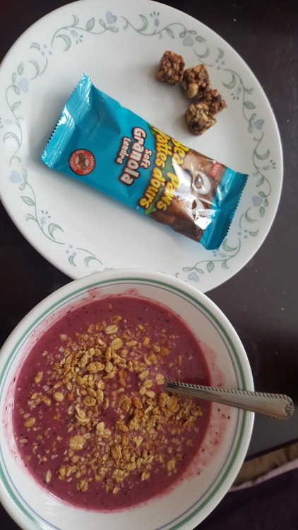 Lunch! Smoothie bowl with protein granola, a granola bar and a...
