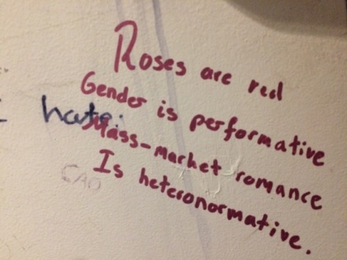“Roses are red / Gender is performative / Mass-market romance  /...