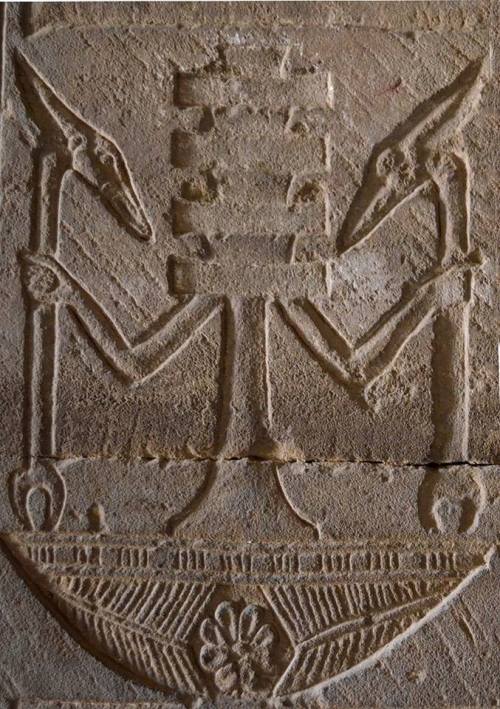Personified Djed pillar standing on the neb basket and holding two Was-scepters. Detail from the Temple of Hathor at Dendera
