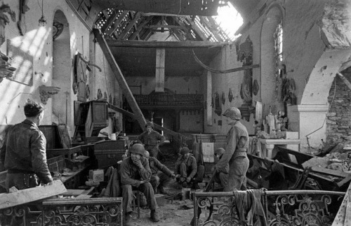 demons:American infantrymen resting inside of the church at...
