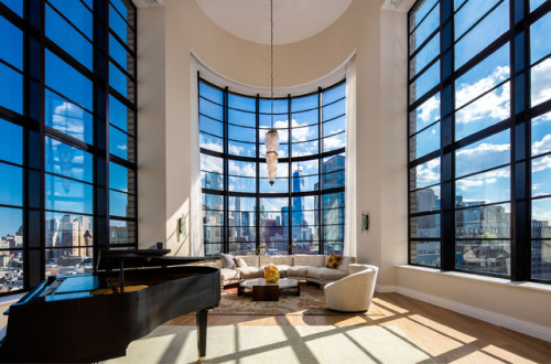 stylish-homes - Penthouse living room with curved windows and...