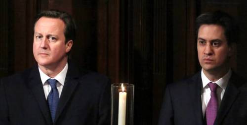 David Cameron and his party rival Ed Silliband sit in anguish as...