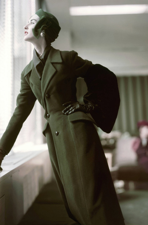 wehadfacesthen - Model wearing a coat by Christian Dior in a 1952...