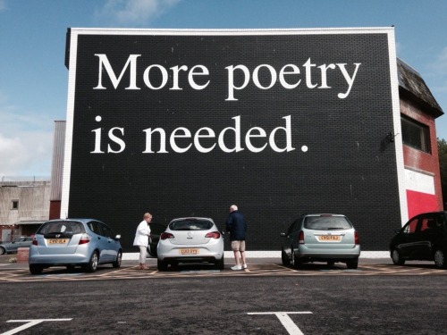 bookmania:A huge print in black and white, ‘More Poetry Is...