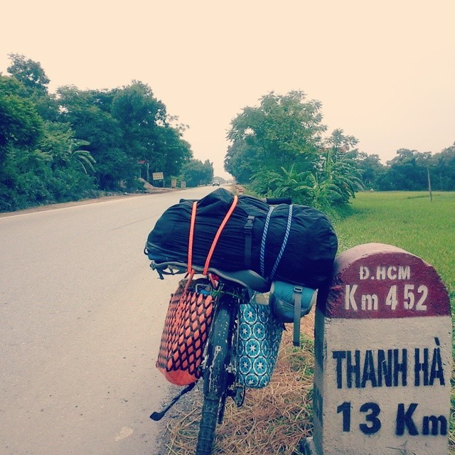 Ho Chi Minh Highway KM 1 for me. I did 91km from Hanoi to Yen Thuy today. Didn’t realize I colour coordinated the bungee straps with my stylish saddle bags until posting this picture. Please believe me. (at Yên Thủy)