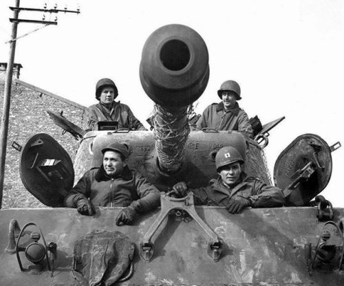 warhistoryonline - An American M4A3 Sherman tank crew of the 7th...