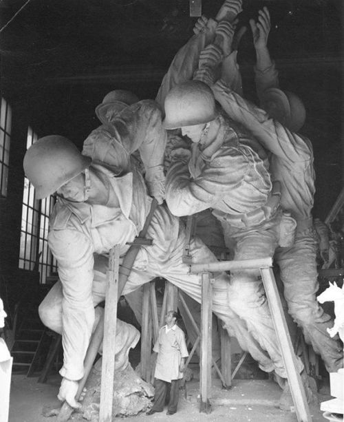 warhistoryonline - Sculptor Felix de Weldon working on the plaster...