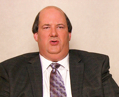 Kevin from the office crossing his arms and rolling his eyes