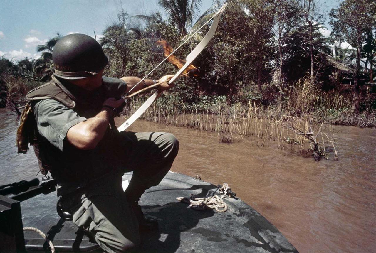 historicaltimes:
“ Lieutenant Commander Donald D. Sheppard, of Coronado, California, aims a flaming arrow at a bamboo hut concealing a fortified Viet Cong bunker on the banks of the Bassac River, Vietnam, on December 8, 1967.
”