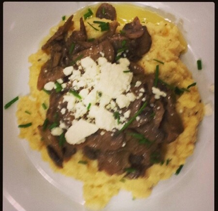 Creamy Polenta with a Mushroom Sauce topped with Goat Cheese .