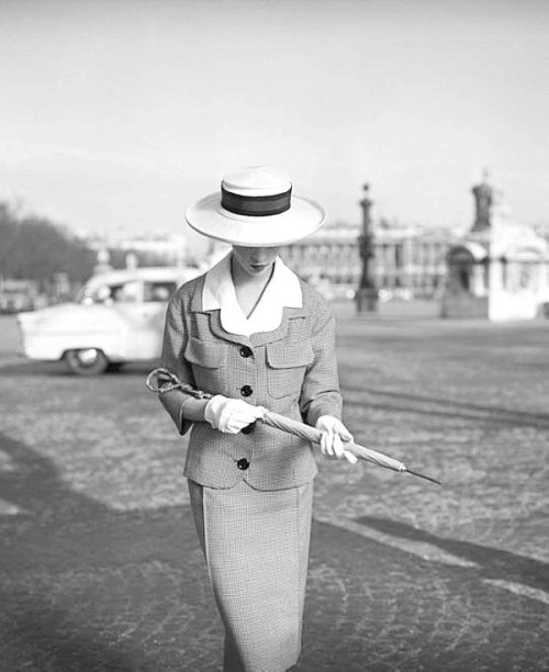 Model wears a suit by Jean Patou in a photo by Georges Dambier,...