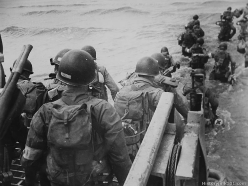 captain-price-official:American soldiers wade into the surf on...