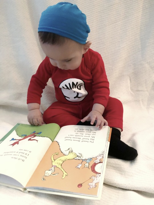 Baby reading a Dr. Seuss Book