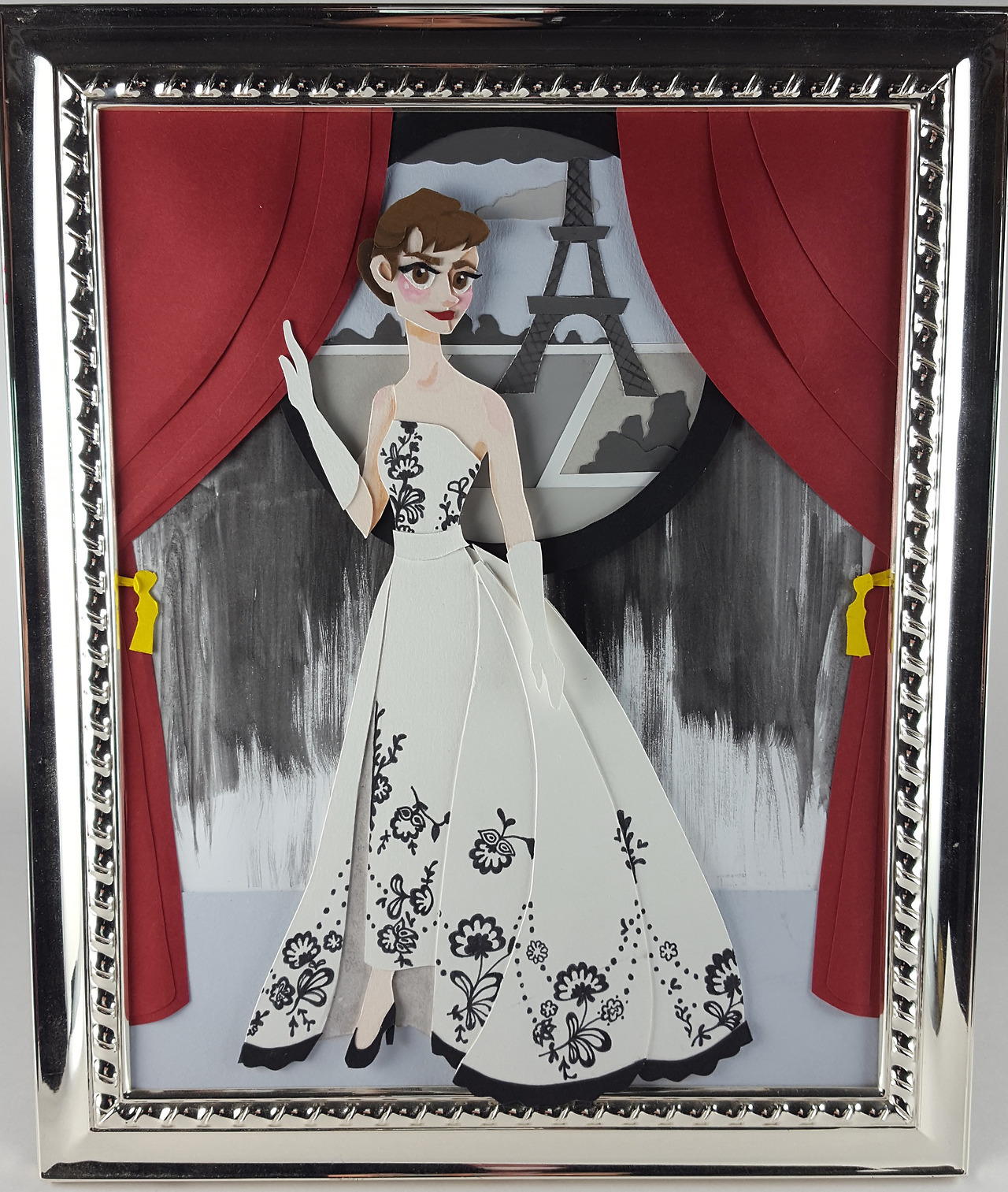 Sabrina in Paris is an illustration of Audrey Hepburn in her role as Sabrina from the 1954 film Sabrina. It shows her character in her white and black lace ball gown, which in the movie signifies her change from a shy and lovesick, invisible girl, to...