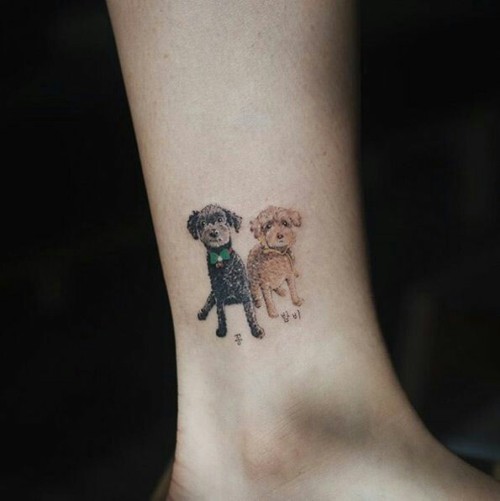 Little cute dog wrist tattoo.
