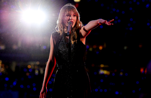 tswiftsedits:Taylor Swift performs on stage during her...