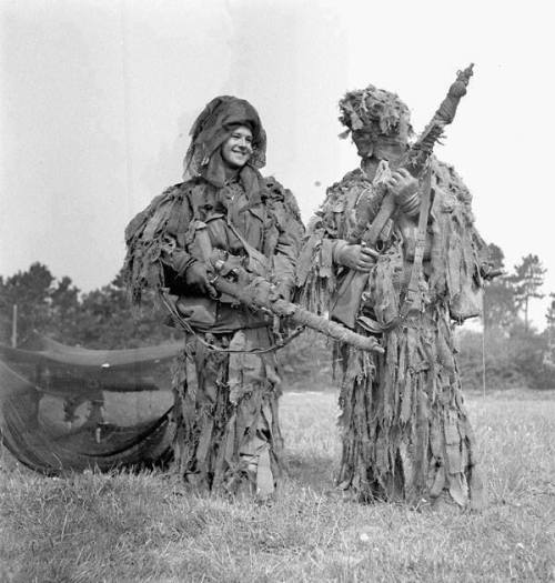 warhistoryonline - Two unidentified snipers, in “ghillie” suits,...
