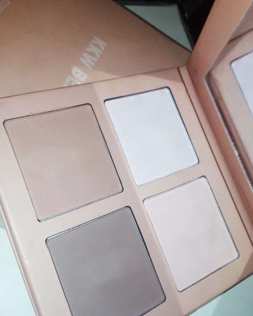 The #KKWBEAUTY Powder Contour & Highlight Kit features two...