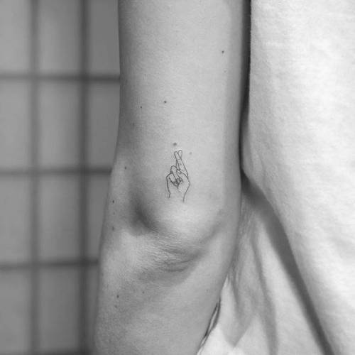 By Christopher Vasquez, done at West 4 Tattoo, Manhattan.... vasquez;small;anatomy;micro;line art;crossed fingers;tricep;tiny;ifttt;little;minimalist;hand;fine line