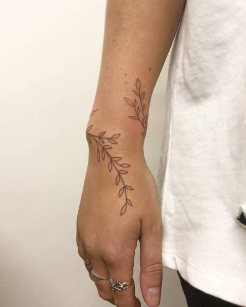 By Naraishikawa, done at Die-Monde Tattoo, Wadebridge.... flower;small;leaf;tiny;flower wreath;hand poked;ifttt;little;wristband;nature;wrist;medium size;naraishikawa;band