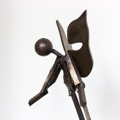 Falling angel metal sculture made by a prisoner in a soldering /...