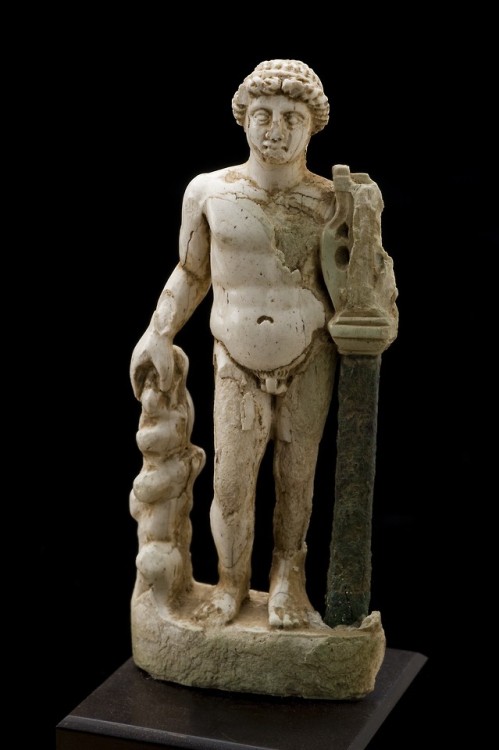 lionofchaeronea - Roman ivory statue of Apollo, shown holding a...
