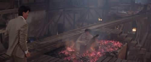 butts-and-uppercuts - Jackie Chan crawls across real hot coals...