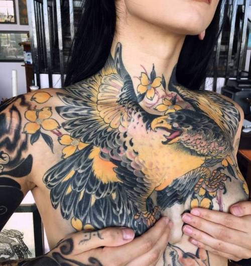 Black bird tattoo on the chest