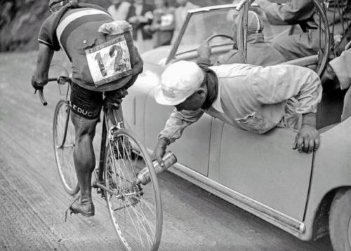 historicaltimes - Italian cyclist Gino Sciardis getting his bike...