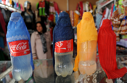 visitafghanistan - A store displays miniature burqa designs on...