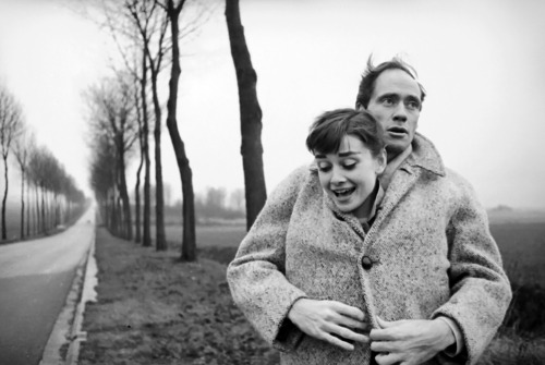 Audrey Hepburn and husband Mel Ferrer stop to take pictures on...