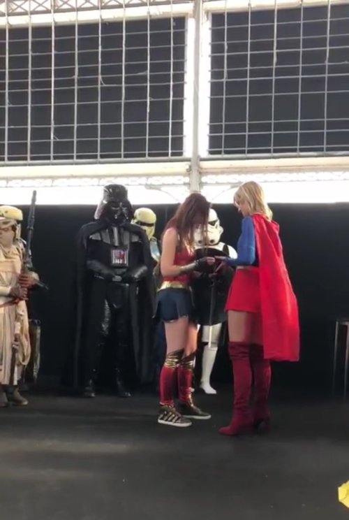 crowtrobot2001 - Wonder Woman proposing to Supergirl in the...