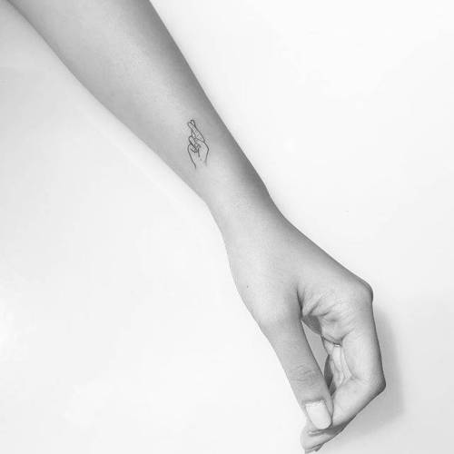 By Christopher Vasquez, done at West 4 Tattoo, Manhattan.... vasquez;small;anatomy;micro;line art;crossed fingers;tiny;ifttt;little;forearm;minimalist;hand;fine line
