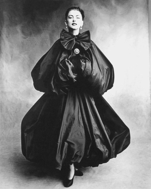 wehadfacesthen - Model wears an evening gown and cape by...