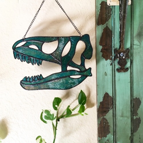 sosuperawesome:Stained Glass Dinosaur and Unicorn Skulls, by...