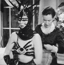 Norma Shearer getting dressed for a costume party in Riptide...