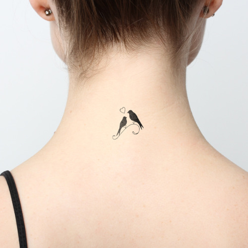 Birds in love temporary tattoo on the back of the...