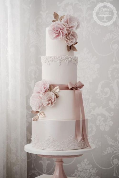 A 4 tier pastel pink wedding cake by Cotton & Crumbs. 