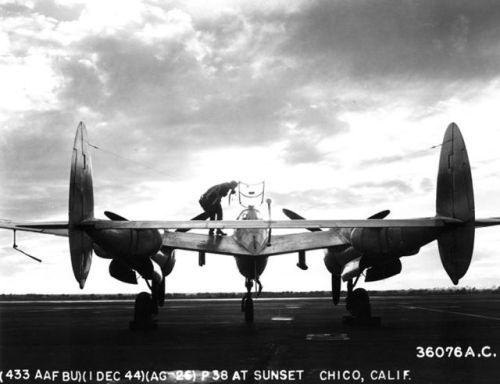 warhistoryonline - P-38 Lightning aircraft at rest on an...