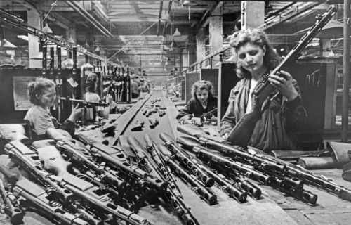 historicaltimes - Women work on the assembly line at a...
