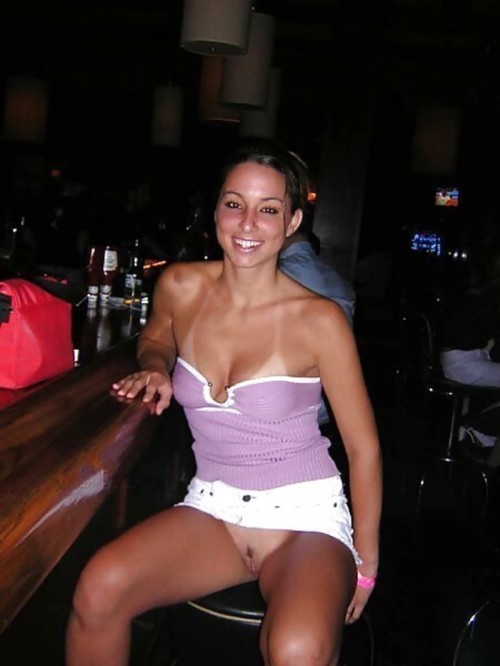carelessinpublic:In a short skirt inside a bar and showing her...