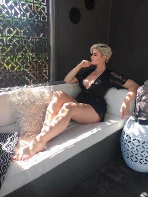 Stefania Ferrario on a couch with dappled sunlight on her legs.