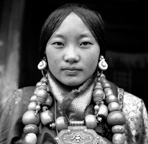 2000-lightyearsfromhome:A Tibetan aristocratic woman in array,...