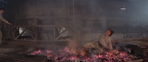 butts-and-uppercuts - Jackie Chan crawls across real hot coals...
