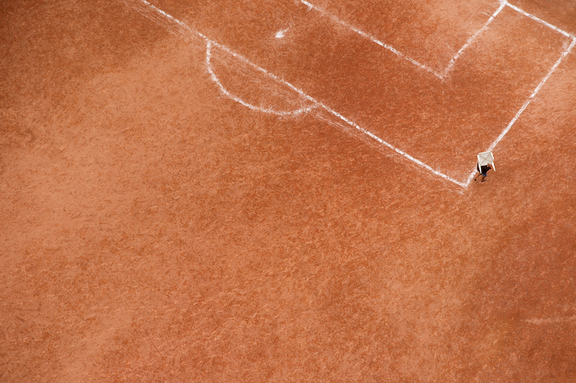 Ground From Above - Terrão de Cima by Renato Stockler “A ‘terrão’ (earthen field) is an oasis in the urban landscape. The reddish tone of a soccer field turns into a stage for resistance of popular soccer. These fields are increasingly rare to be...