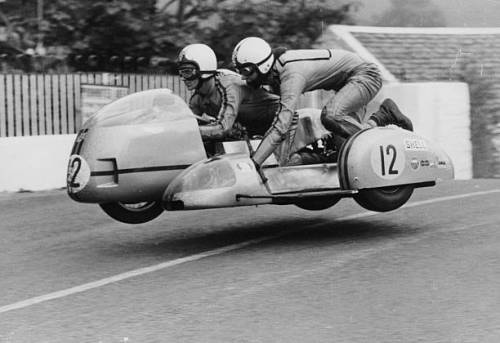 Sidecar TT race Isle of Man 1970 on Ballaugh Bridge. 